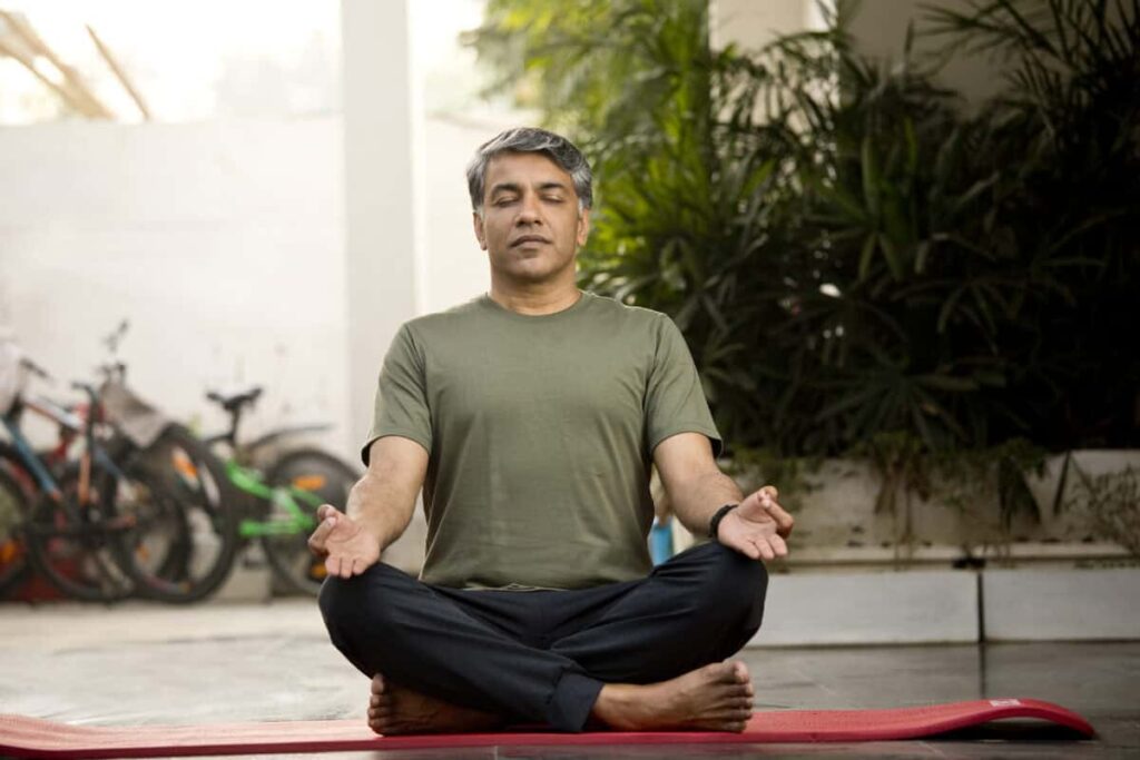 These Are the Dividend Stocks I’d Hold Through Any Economy Man meditating in lotus position outdoor on patio