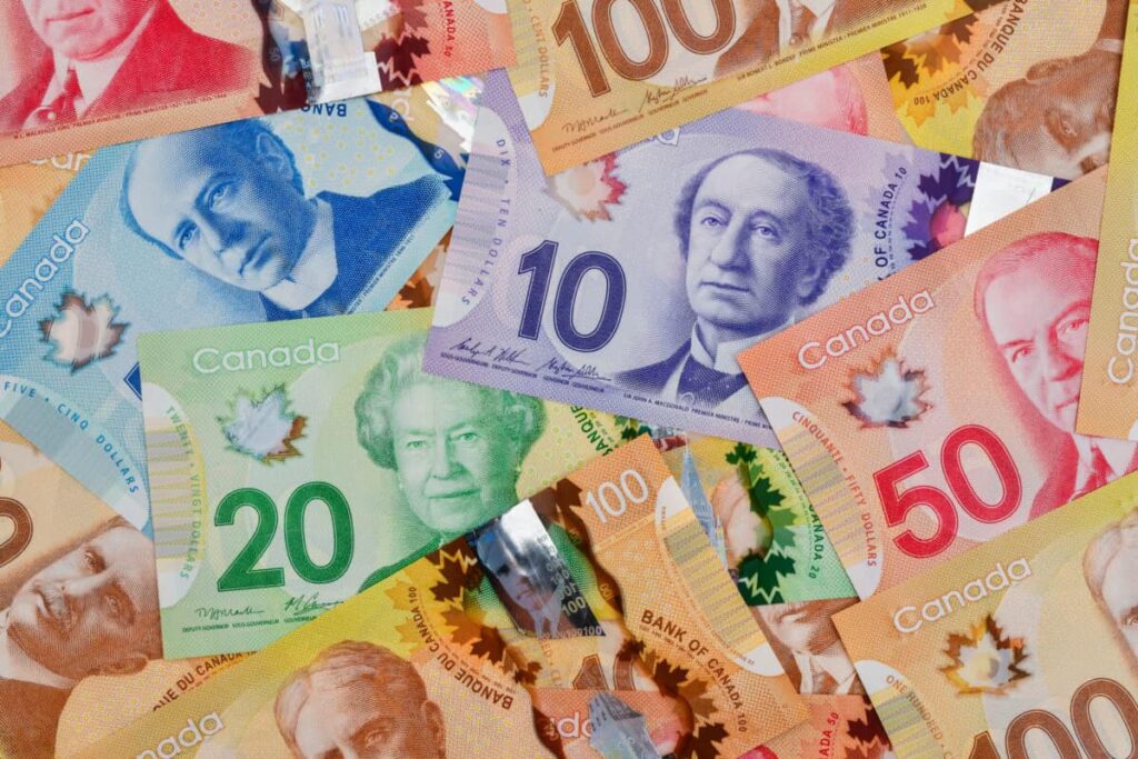 Want Monthly Cash Flow? This 4.2% Dividend Stock Delivers Pile of Canadian dollar bills in various denominations